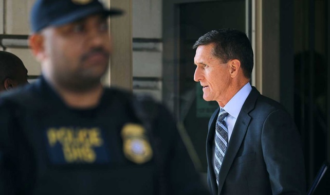 Flynn walks out of a federal courthouse in Washington to chants of 'Lock him up' (Getty Images)