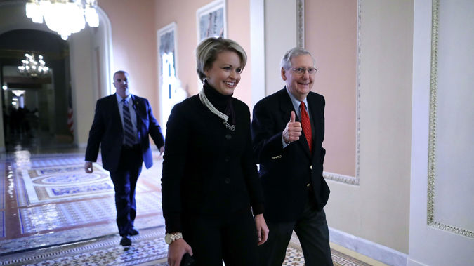 Senate Majority leader Mitch McConnell showing his joy. (Photo/Getty)