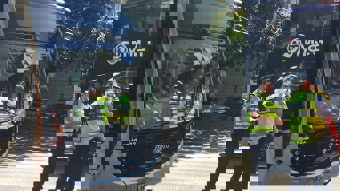 The bus window is smashed in the lower left corner. (Photo / Tess Nichol)