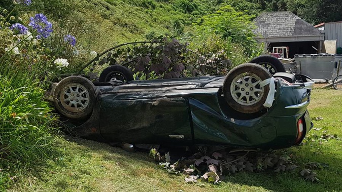 One car fell down a bank, while another crashed into a house. (Photo / Supplied)