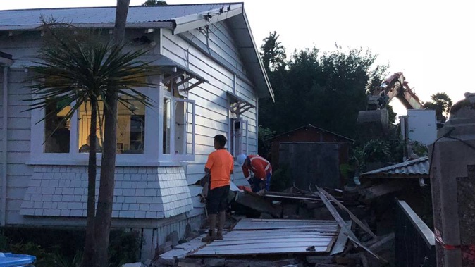 Fire and Emergency spokesman Paul Radden says the house, on Moa Rd, was being demolished when it fell onto the house next door. (Photo / NZ Herald)