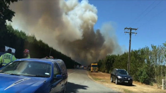Two houses were destroyed in the fast moving fire, and firefighters will probably be there all day. (Photo: Ashburton TV)