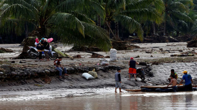 Floods across the Philippines from tropical storm Tembin have killed over 200 people. (Photo: Getty Images)