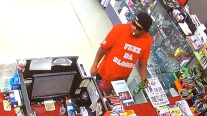 Police released this picture of the offender wearing a red t-shirt and black jeans with a red bandana tucked in to the waistline. (Photo: NZ Police)