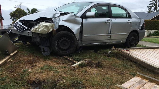 The car that ploughed through Heath Moore's fence (Photo / Heath Moore)