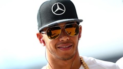 Lewis Hamilton has apologised for posting a video where he tells his young nephew that 'boys don't wear dresses'.