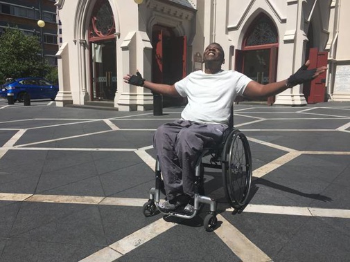 Paraplegic Silice Karito has been reunited with his wheelchair after a nightmare 48 hours stuck in a hotel room. (Photo / NZ Herald)