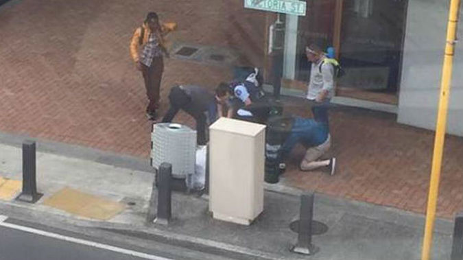 Members of the public were quick to assist an overpowered cop as she arrested a man much larger than herself. (Photo / Facebook)