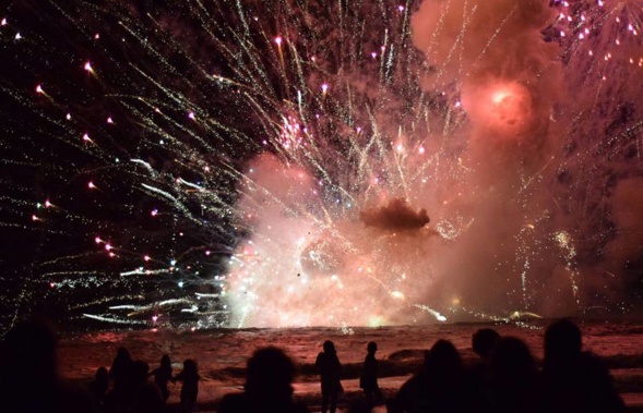 The moment the barge of fireworks exploded at Terrigal. (Photo / Pip Cleaves - Twitter)