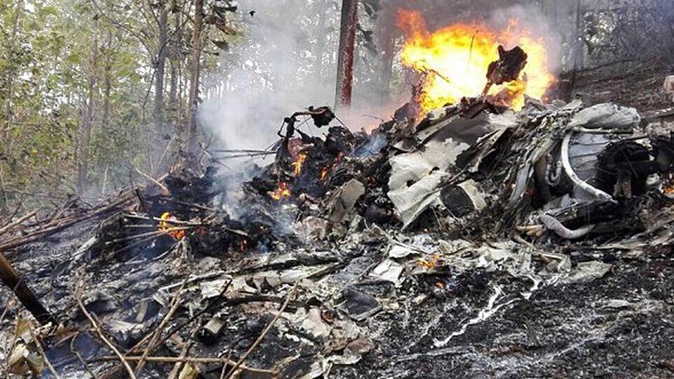 The Public Safety Ministry posted photos of the crash site showing the burning wreckage. (Photo / Facebook)