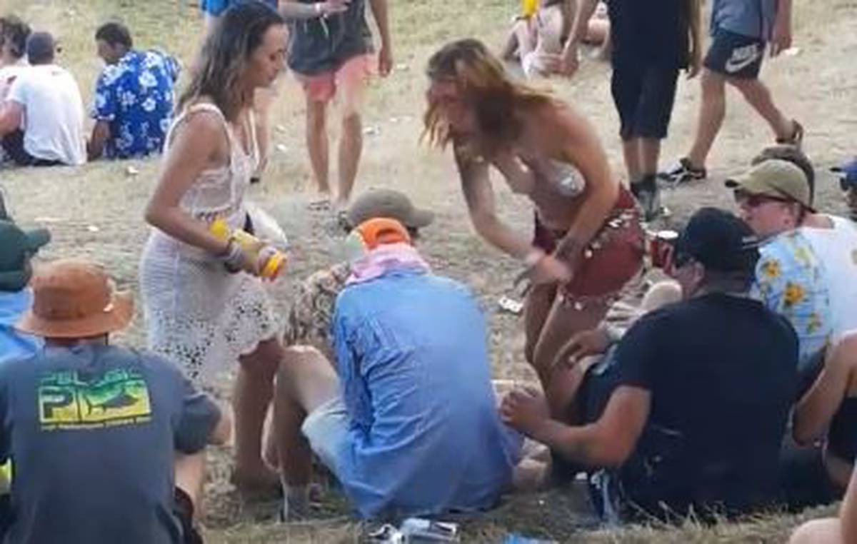 Video has emerged of the moment a reveller at Rhythm and Vines reacts after a man grabs her. (Video/Giann Reece)