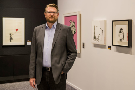 The exhibition features 89 Banksy works valued at approximately $40 million and is curated by Steve Lazarides. (Photo \ Getty Images)