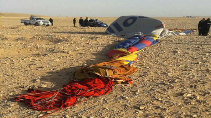 The remains of a hot air balloon are seen on the ground near the ancient city of Luxor after the fatal crash. (Photo: AFP)