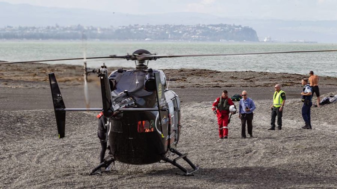Police waders are scouring the river mouth of the Tukituki River, which lets out near the beach. (Photo / Warren Buckland)