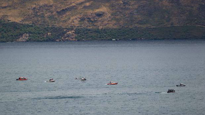 Search and rescue operation taking place on Lake Wakatipu after two skydivers crashed into the lake. (Photo/ James Allan)