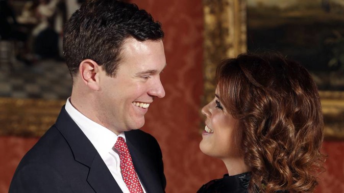 Britain's Princess Eugenie and Jack Brooksbank pose for the media in the Picture Gallery at Buckingham Palace after they announced their engagement in London yesterday. (Photo / AP)