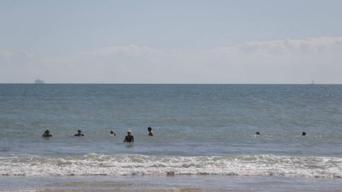 Beach goers are still swimming at Milford beach after the sewage leak. (Photo: Michael Craig)