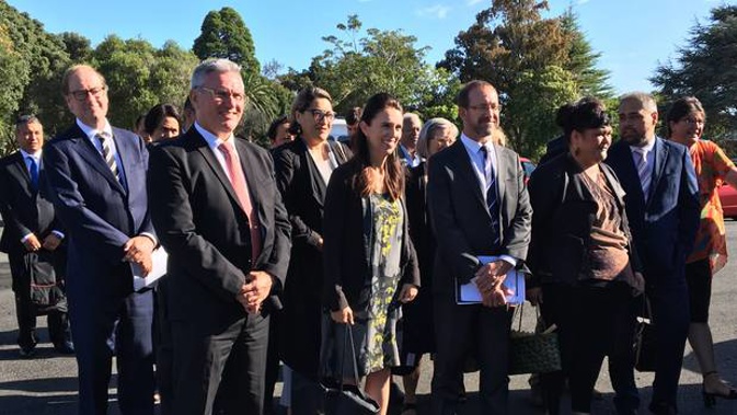 Prime Minister Jacinda Ardern arrives at Waitangi for a meeting with the Iwi Leaders' Forum. Flanked by minsters Kelvin Davis (front left), Andrew Little and Nanaia Mahuta. (Photo / Claire Trevett)