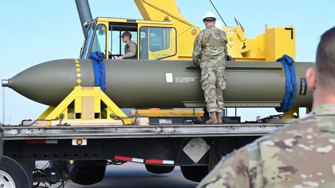 Airmen look at a GBU-57, or Massive Ordnance Penetrator bomb, at Whiteman Air Force Base in Missouri in 2023. Photo / US Air Force