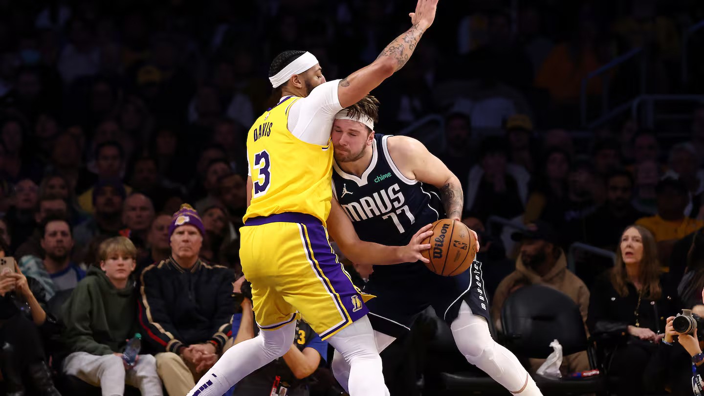 Luka Doncic drives to the basket against Anthony Davis. Photo / Getty Images