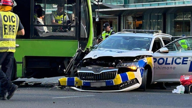 Two police staff have been injured after being involved in a serious crash with a bus in the Auckland CBD.