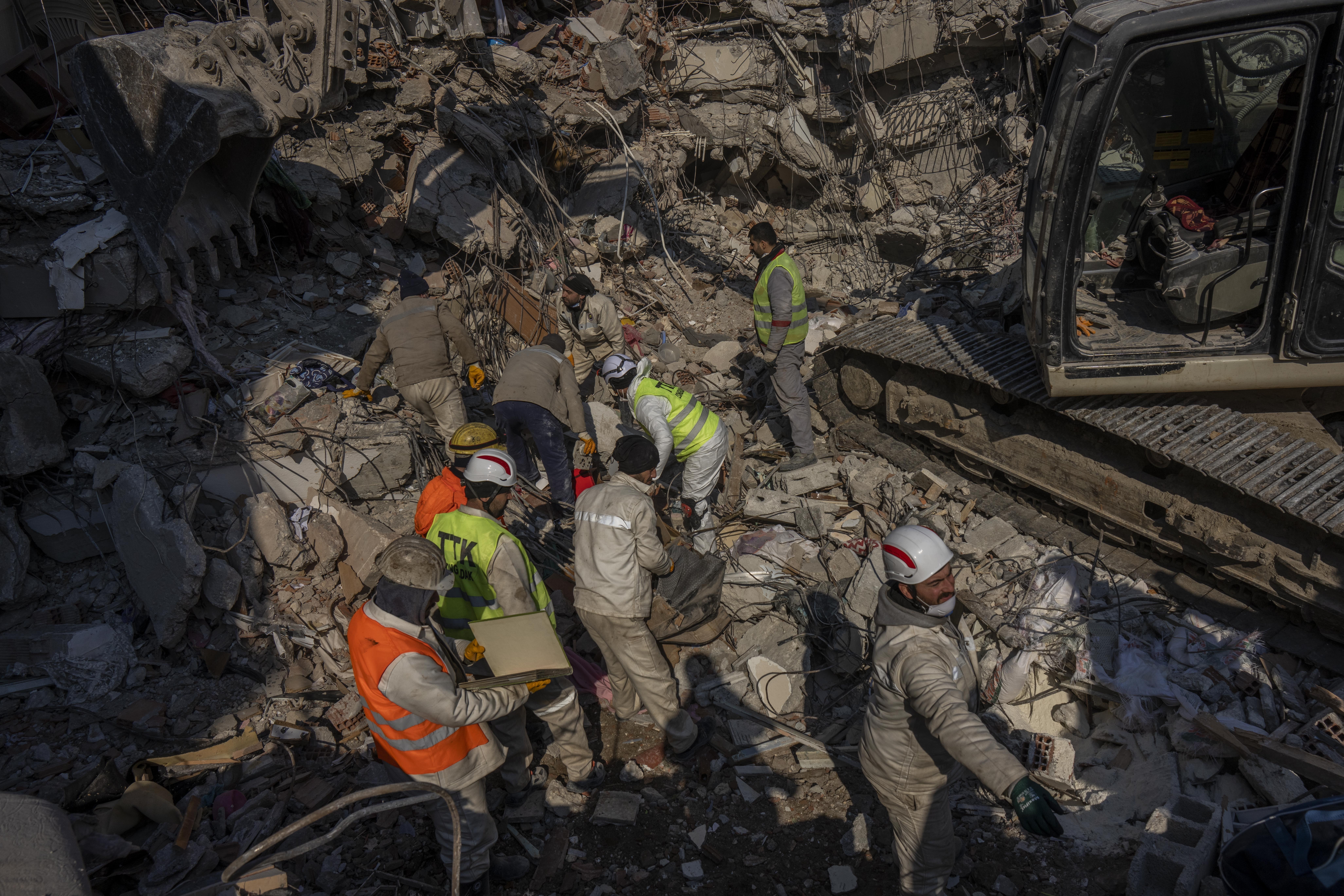 Members of a search and rescue team work on a collapsed structure after the earthquake in Antakya, southeastern Turkey. Photo / AP
