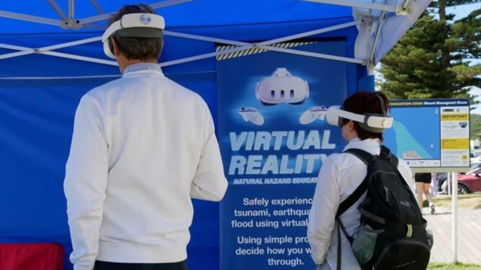 A virtual reality (VR) simulation will be at the beach this summer, giving users the opportunity to experience the predicted impacts of an earthquake and tsunami on the Mount Maunganui coastline. Photo / Tauranga City Council