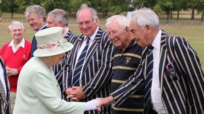 Ron Brierley in 2015 (second from right) meeting the Queen, who has accepted his resignation as a Knight. (Photo / Supplied)