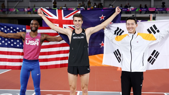 Gold medallist Hamish Kerr along with silver medallist Shelby McEwen of Team United States and bronze medallist Sanghyeok Woo of Team South Korea after the Men's High Jump Final during the World Athletics Indoor Championships 2024. Photo / Getty