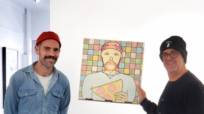 Vincent Michaelsen, of Vinci's Pizza, and Richard Boyd-Dunlop, of Boyd-Dunlop Gallery, holding an entry to the inaugural art on a pizza box competition at Boyd-Dunlop Gallery, Napier.