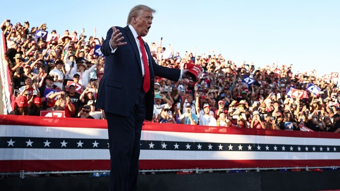 Republican presidential nominee, former US President Donald Trump gestures as he walks on stage for a campaign rally on October 12, 2024 in Coachella, California. Photo / Getty Images