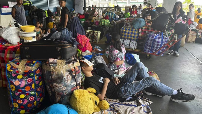 The powerful typhoon blew closer to the northern Philippines on Tuesday, forcing thousands of evacuations and a halt to sea travel ahead of torrential rains and tidal surges up to 3 meters. Photo / AP