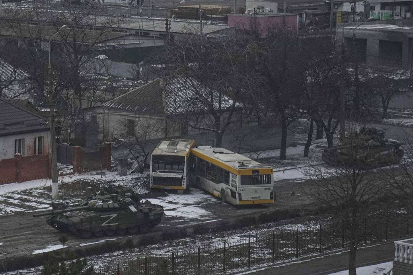 Russian's army tanks move down a street on the outskirts of Mariupol, Ukraine.