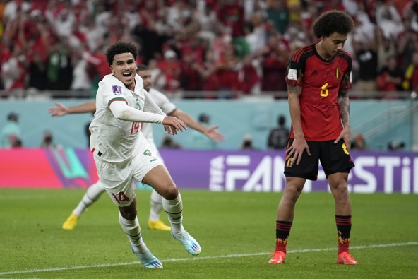 Morocco's Zakaria Aboukhlal celebrates his side's second goal besides Belgium's Axel Witsel during the World Cup group F soccer match between Belgium and Morocco, at the Al Thumama Stadium in Doha, Qatar, Sunday, Nov. 27, 2022.
