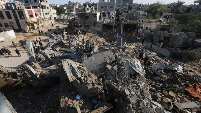 Palestinians look at the destruction caused by the Israeli bombardment of the Gaza Strip in Rafah on Monday, December 4, 2023. Photo / AP