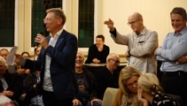 'Finger guns': Local board member apologises for gun-to-head gesture at Govt minister