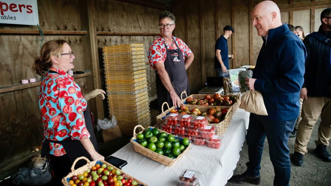 Prime Minister Christopher Luxon at a farmers market in Clevedon this morning. Photo / Alex Burton