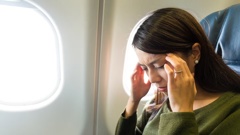 The woman was caught out by her boss, who happened to be on the same flight. Photo / 123rf