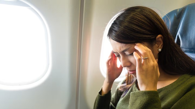 The woman was caught out by her boss, who happened to be on the same flight. Photo / 123rf