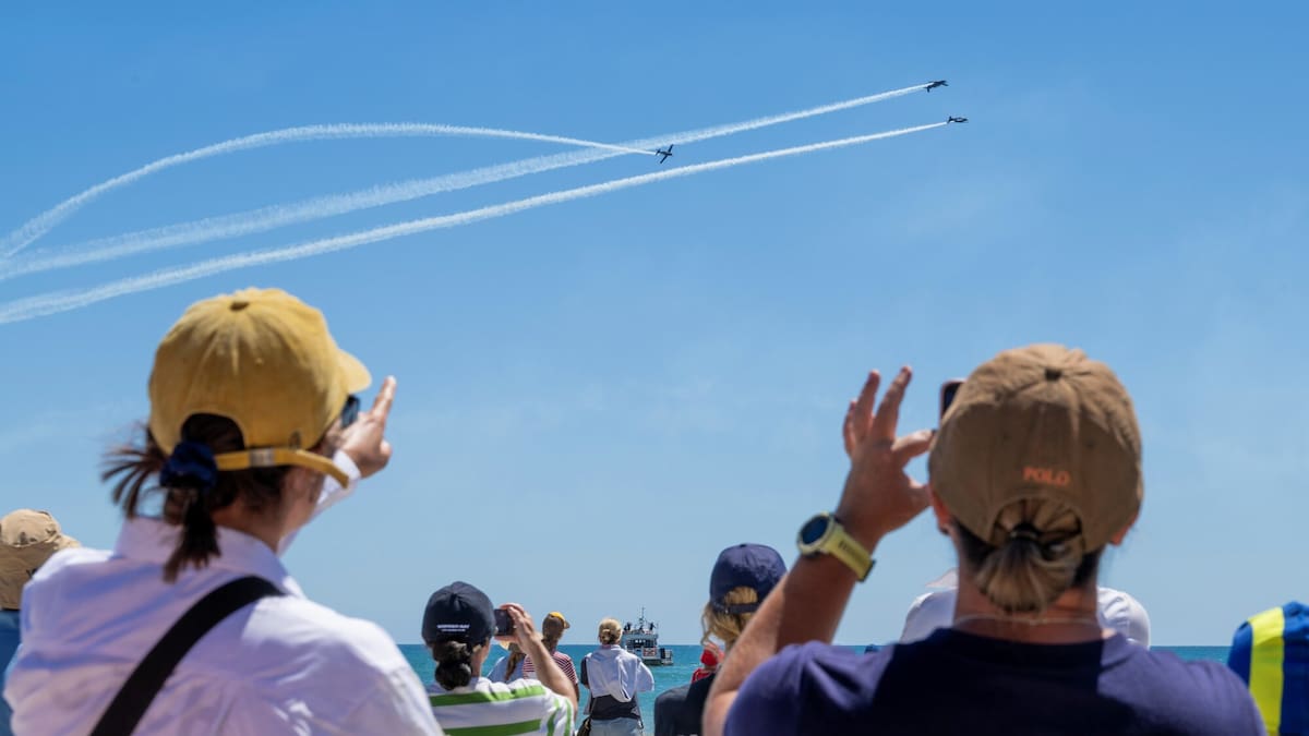 Watch: Black Falcons honour landslide victims with display over surf lifesaving event