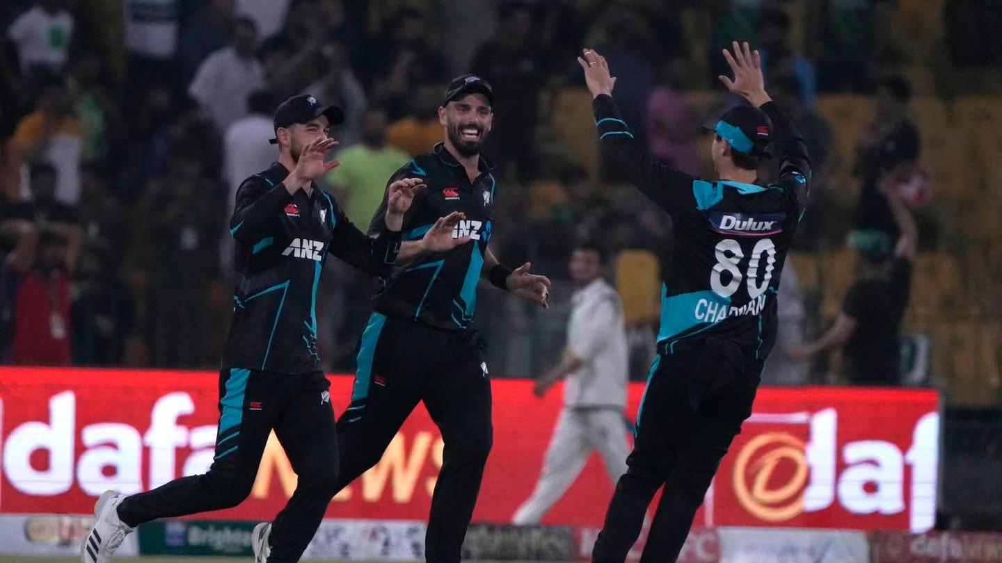 New Zealand's Mark Chapman, right, celebrates with teammates after the dismissal of Pakistan's Iftikhar Ahmed. Photo / AP