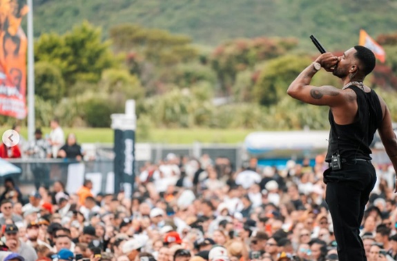 A police officer was hit with a bottle and there were scenes of intoxication, disorder and assault involving people - including suspected gang members - outside the Juicy Fest music festival in Wellington.