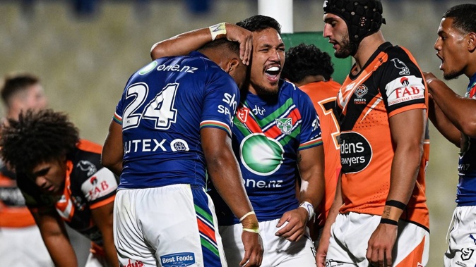 Michael Sio of the Warriors celebrates a try from Solomon Vasuvulagi. Photosport