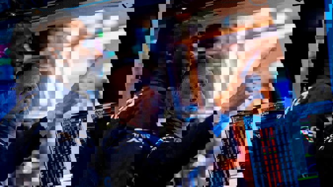 Traders on the New York Stock Exchange floor. All the action stemmed from a US government report showing inflation slowed in October for a fourth straight month. Photo / AP