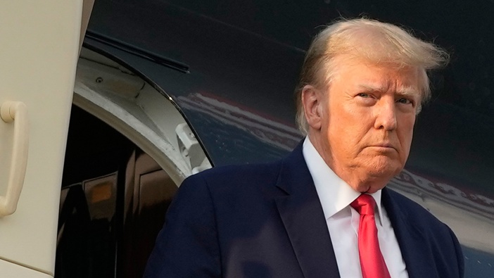 Former President Donald Trump steps off his plane as he arrives at Hartsfield-Jackson Atlanta International Airport on Thursday, August 24. (Photo / AP)