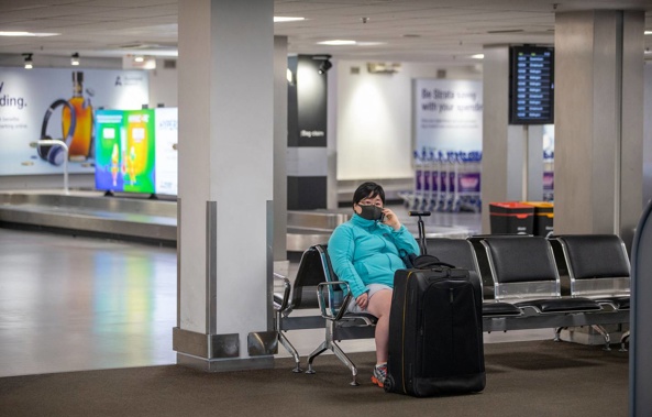 A passenger inside an almost deserted domestic terminal early in the pandemic. (Photo / Peter Meecham)