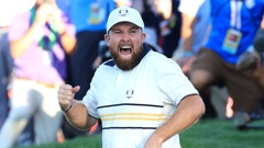 Shane Lowry of Europe celebrates holing a putt on the 18th green to retain the Ryder Cup. Photo / Getty Images