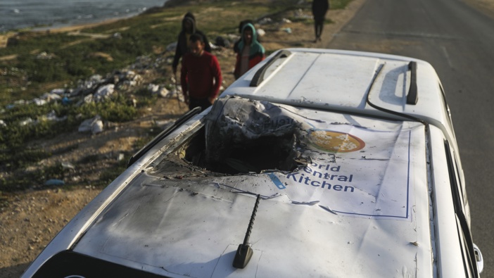 Palestinians inspect a vehicle with the logo of the World Central Kitchen wrecked by an Israeli airstrike in Deir al Balah, Gaza Strip, Tuesday, April 2, 2024. Photo / AP