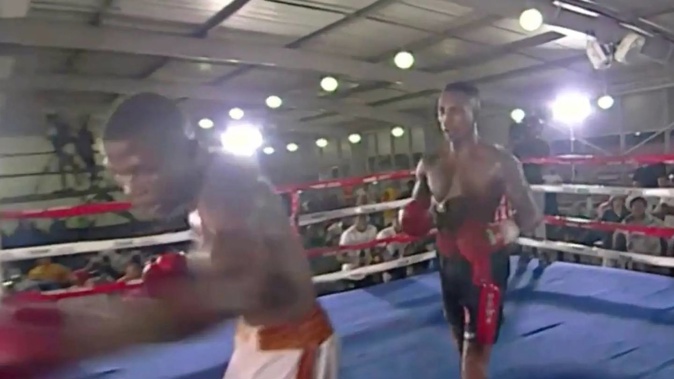 Simiso Buthelezi, left, started swinging at the air during his fight against Siphesihle Mntungwa. Photo / @TimBoxeo