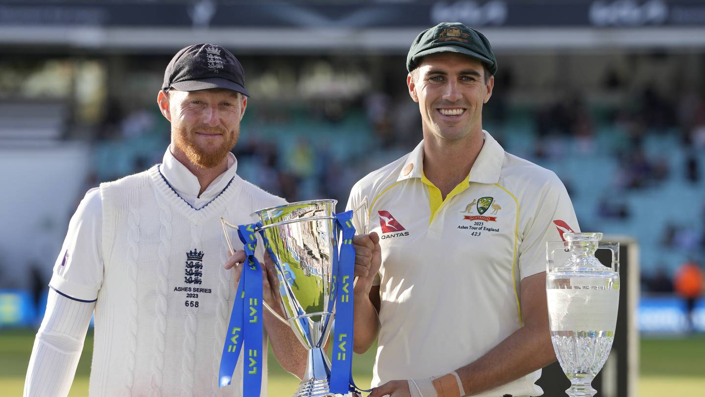 England's captain Ben Stokes, left, and Australia's captain Pat Cummins, right, pose with the Series Trophies. Photo / AP